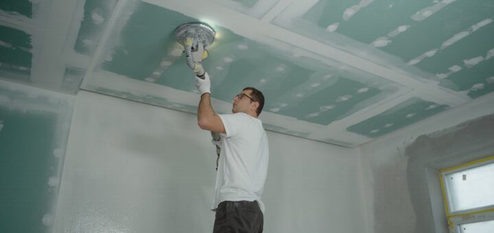 Man Polishing the Ceiling